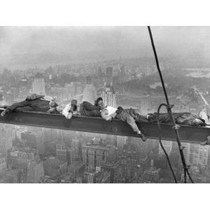 Anonymous - Construction Workers Resting on Steel Beam Above Manhattan, 1932