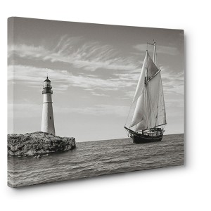 Pangea Images -  Sailboat approaching Lighthouse, Mediterranean Sea